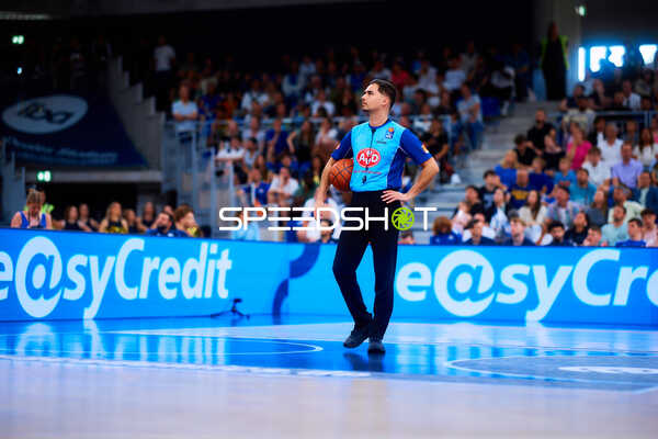 referee holding basketball