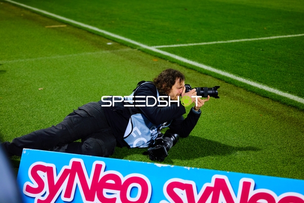 Fotograf am Spielfeldrand