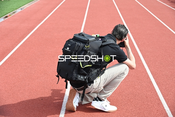 Fotograf auf Laufbahn