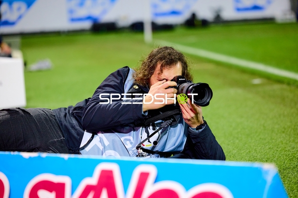 Fotograf am Spielfeldrand