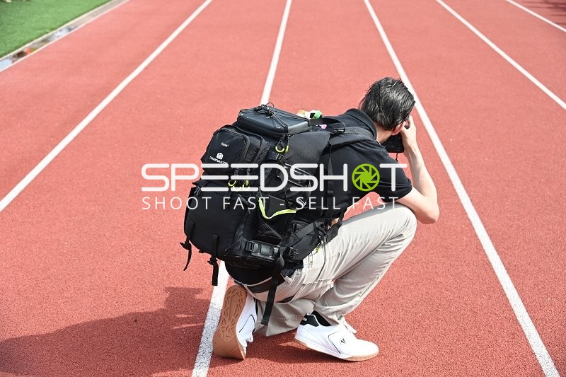 Fotograf auf Laufbahn