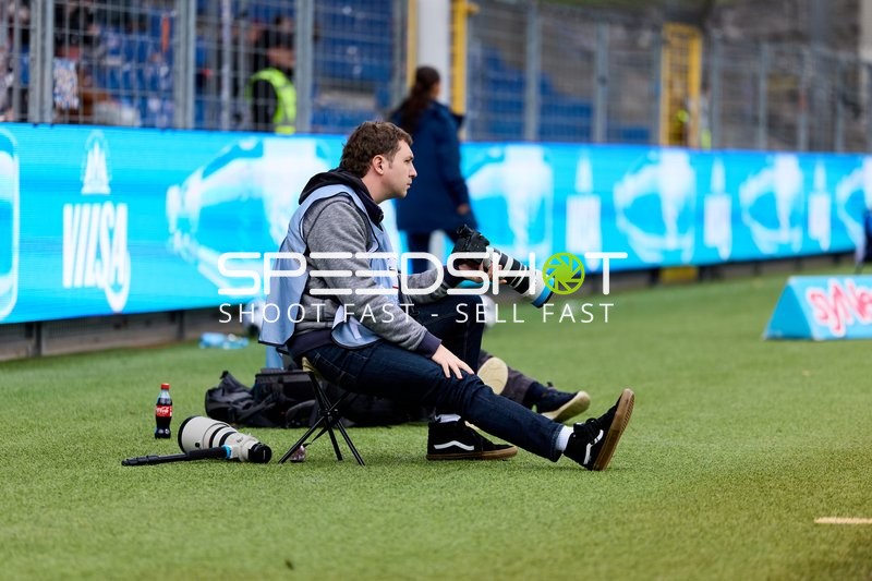 Fotograf am Spielfeldrand