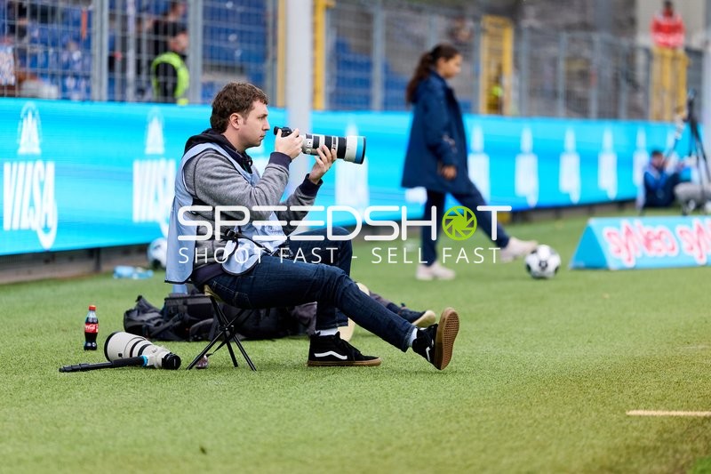 Fotograf am Spielfeldrand